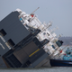 Illustration for article titled These Photos Of That Grounded Car Carrier Ship Are Beautifully Surreal